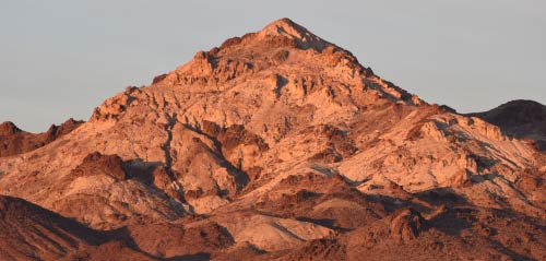 A desert mountain at sunset